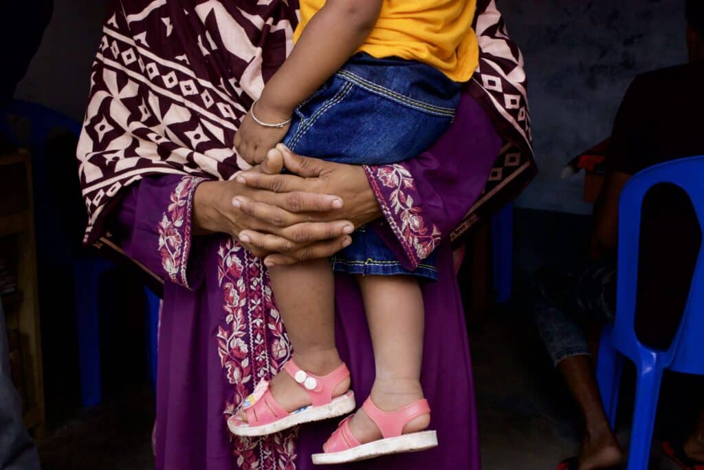 A mum holding her child